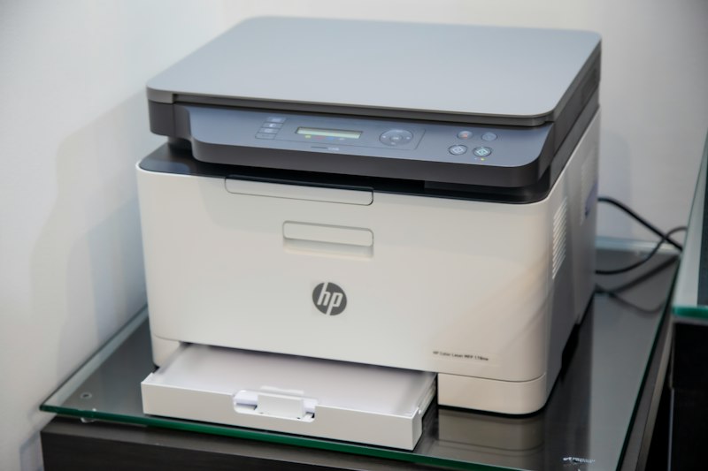 Technician servicing an office printer at Express IT Solutions workshop in Porvorim, Goa